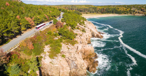 Cars driving on a cliff roadway in Acadia National Park