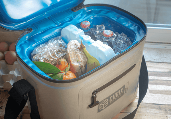 A Cubix Outdoor cooler filled to the brim with snacks and an ice pack
