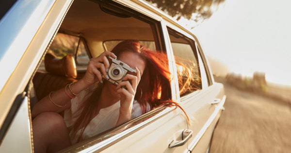 person on a road trip using their camera