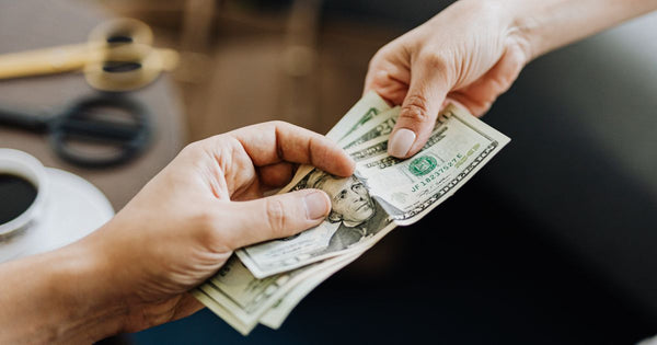 person paying with cash