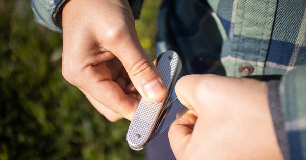 Person using a multi-tool